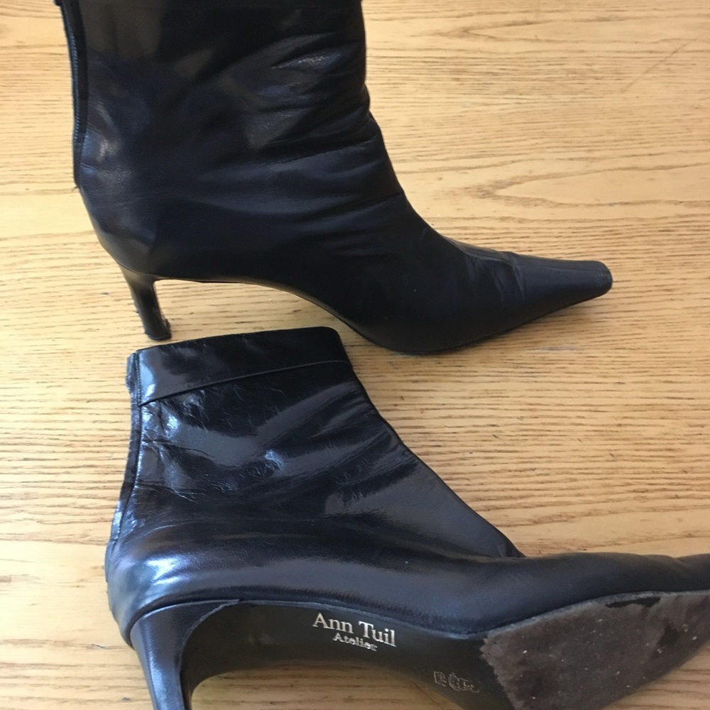 Stylish black ankle boots with small heels.